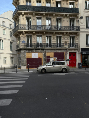 free-photo-of-car-parked-by-crosswalk-near-building2